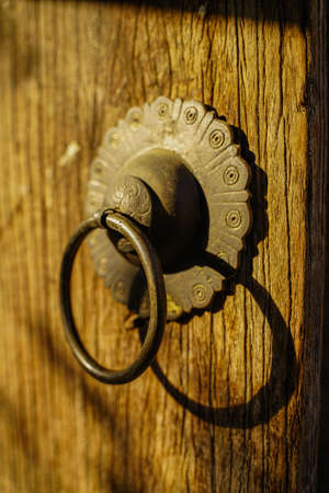 Wooden old wooden door with metal handle