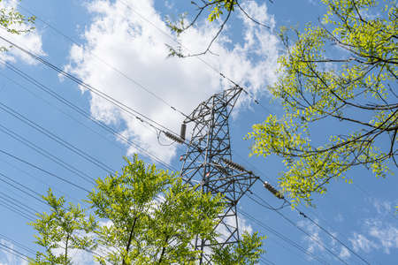 iron tower transmission tower blue sky and white clouds