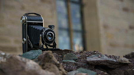 Dated Camera on a prehistoric Wallの写真素材