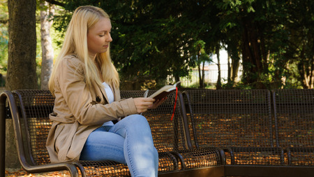 Sweet young blond women writing in her diaryの写真素材