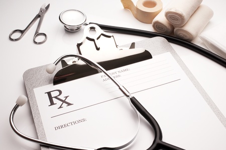 rx prescription concept stethoscope and bandages on white tableの写真素材