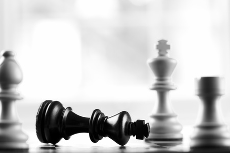 Checkmate white defeats black king selective focus の写真素材