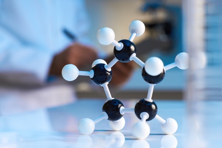 close up of molecular model with scientist in the background の写真素材