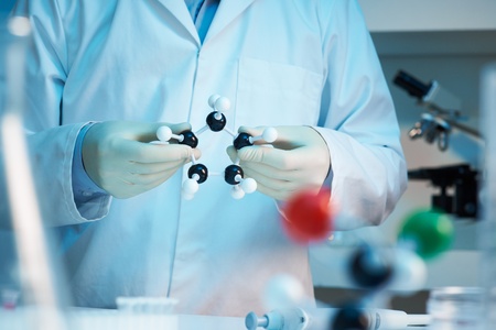 Scientist holding molecular model selective focus の写真素材