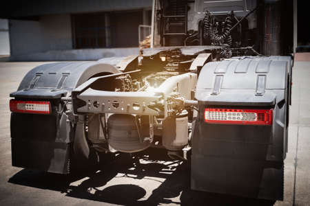 The front wheel of a racing car is visible in the sunlight.の写真素材