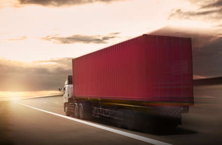 Semi Trailer Truck Driving on the Road with The Sunset Sky. Shipping Freight Truck. Logistics Cargo...