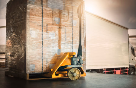 Packaging Boxes Wrapped Plastic Stacked on Pallets Loading into Cargo Trucks. Shipping Trucks. Supply Chain Shipment Boxes. Distribution Supplies Warehouse. Freight Truck Logisticsの写真素材