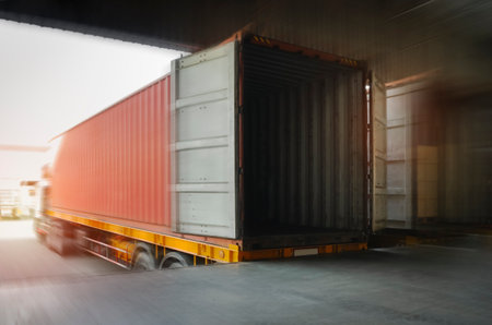 Contaner Trailer Trucks Parked Loading at Dock Warehouse. Shipping Cargo Container Delivery Trucks....