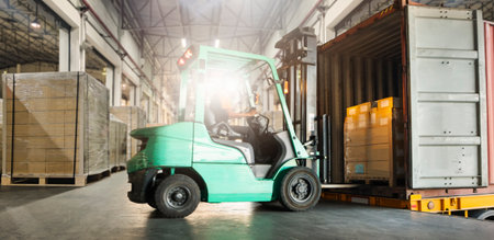Forklift Tractor Loading Packaging Boxes into Container Trucks. Forklift Pallets Truck, Loader. Delivery Sending to Customers. Shipment Supplies Warehouse. Freight Truck Logisticsの写真素材