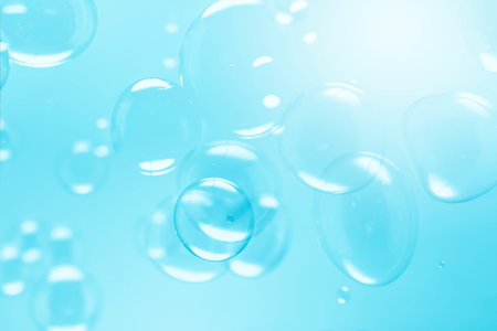 Freshness of Transparent Blue Soap Bubbles Abstract Background. Soap Sud Bubbles Water.の写真素材