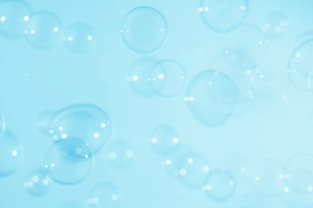 Bubbles on a blue background. Abstract background for design.の写真素材