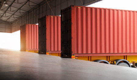 Cargo Container Trucks Parked Loading Dock at Dock Warehouse. Shipping Trucks. Cargo Freight Trucks...