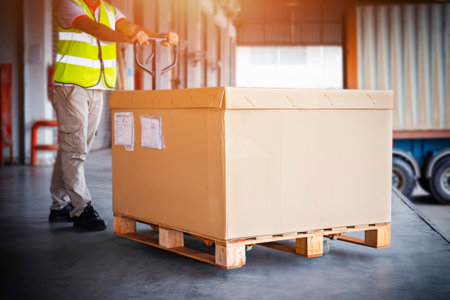 Heavy Boxes Pallet. Workers Unloading Package Boxes in Warehouse. Shipping Supplies Warehouse....