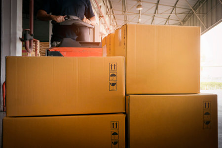 Workers Unloading Package Boxes in Warehouse. Electric Forklift Pallet Jack Loader. Shipping...