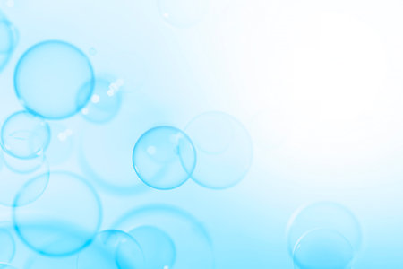 Beautiful Transparent Blue Soap Bubbles Abstract Background. Soap Sud Bubbles Water.の写真素材