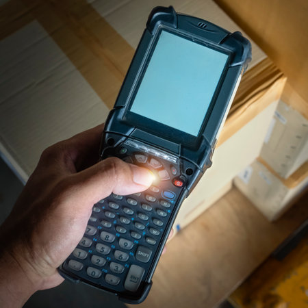 Workers Scanning Bar Code Scanner on Package Boxes. Delivery to Customers. Shipping Storehouse. Shipment Boxes. Computer Scanner Mobile Work Tools. Warehouse Inventory Managementの写真素材