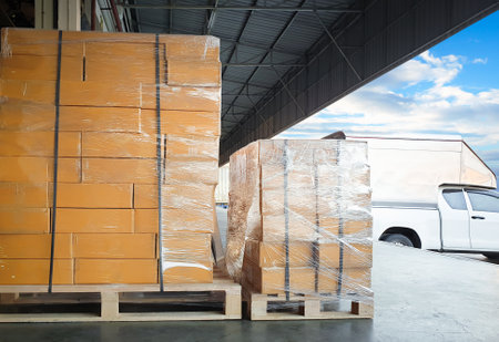 Package Boxes Wrapped Plastic Stacked on Pallets. Warehouse Shipping, Distribution Storehouse,...