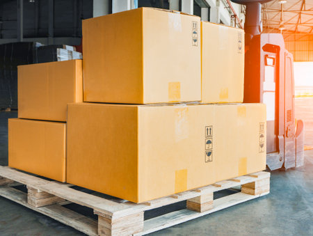 Package Boxes Stack on Wooden Pallets to Send to Customers. Distribution Warehouse Shipping. Supply...