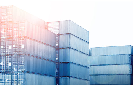 Row of Stacked Containers Cargo Shipping. Handling of Logistic Transportation Industry. Freight Trucks Import-Export. Distribution Warehouse. Shipping Logistics Transport.の写真素材