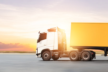 Semi Trailer Trucks Driving on The Road with The Sunset. Cargo Container Shipping. Economy Business Transport on Road. Import- Export. Trucking, Lorry, Freight Truck Logisticsの写真素材