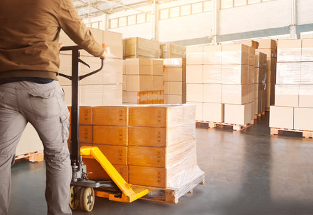 Warehouse Workers Loading a Package Boxes Pallets at Warehouse. Forklift Pallet Jack Loader. Distribution Storage Warehouse. Supply Chain, Supplies Warehouse Shipping. Logistics.の写真素材