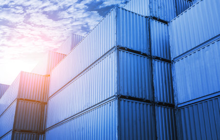 Stacked of Containers Shipping at Port. Handling of Logistic Transportation Industry. Cargo Container ships, Freight Trucks Import-Export. Distribution Warehouse. Shipping Logisticの写真素材