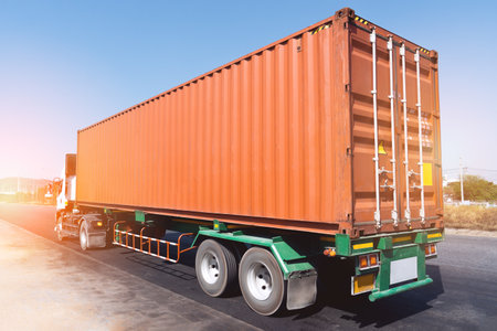 Semi Trailer Trucks Driving on The Road. Cargo Container Shipping. Economy Business Transport on...