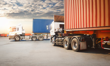 Semi Trailer Trucks on The Parking Lot with Sunset Sky. Big Rig, Tractor Truck. Shipping Cargo...