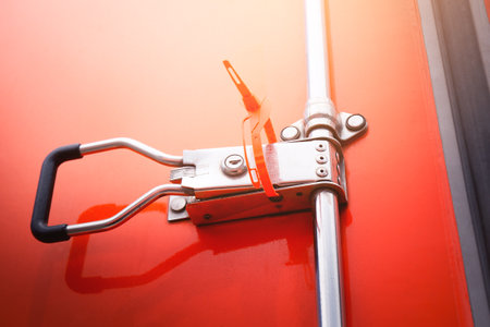 Container door locked with protective seal strap. Delivery van, Shipping cargo Container. Security of cargo shipment. truck transport, logistics freight truck.の写真素材