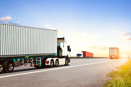 Semi Trailer Trucks Driving on High Way Road. Shipping Containers. Big Rig, Semi Truck. Shipping...
