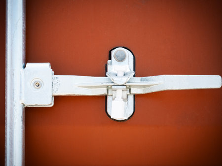 Container door locked with protective lead seal. Box container, security of cargo shipment. cargo shipment. truck transport, shipping container import- export. truck logisticsの写真素材