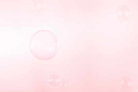 Beautiful Pink Soap Bubbles Floating in The Air. Festive Backdrop. Freshness Soap Suds Bubbles Water. Pink and White Gradient Textured. Abstract Background.の写真素材