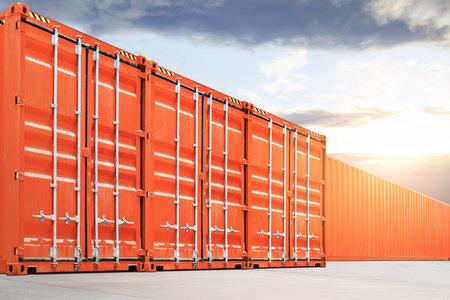 Red Shipping Cargo Containers at The Port. Container Yard. Logistic Transportation Industry. Cargo...
