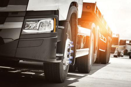 Semi Trailer Trucks Parked on The Parking Lot. Big Rig. Tractor Truck. Truck Wheels Tires. Shipping...