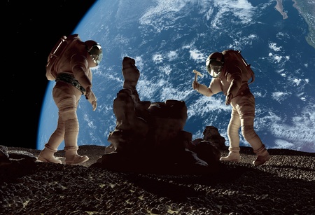 The astronauts on a background of a planet  