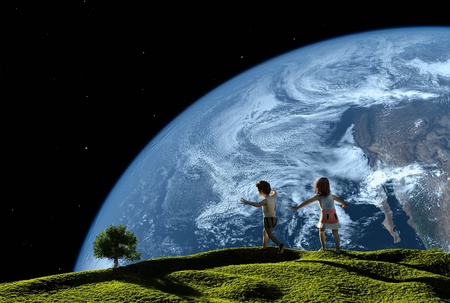 Children play on the grass against the skyの写真素材