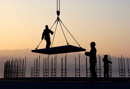 The group of workers working at a construction site.の写真素材