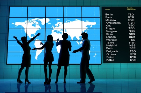 A group of people around the world map.の写真素材
