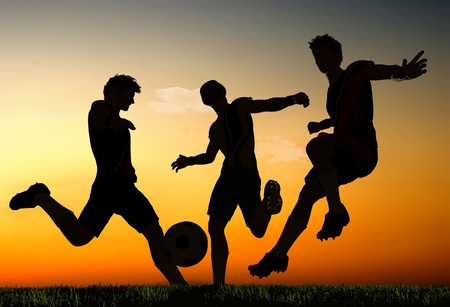 Silhouettes of soccer players.の写真素材