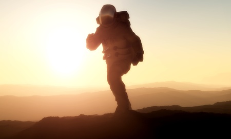 A silhouette of an astronaut in sunlight.の写真素材