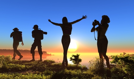 Silhouette of a group of people on the grass.の写真素材