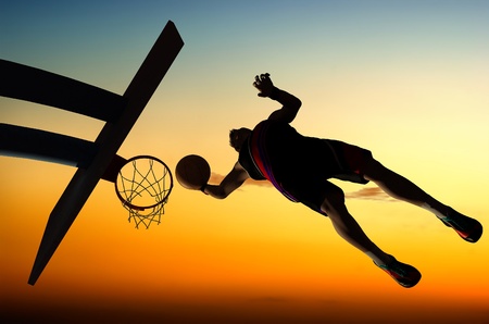 Silhouette of basketball against the sky.の写真素材