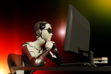 The robot works on the computer    の写真素材