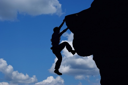 Silhouettes of people in the mountainsの写真素材