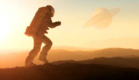 Astronaut silhouette against the background of the planet.の写真素材