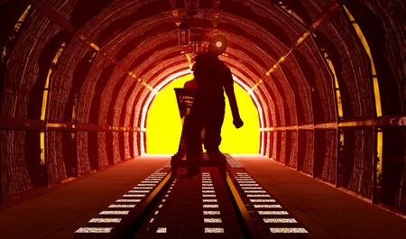 Workers pushing the cart in the mine.の写真素材