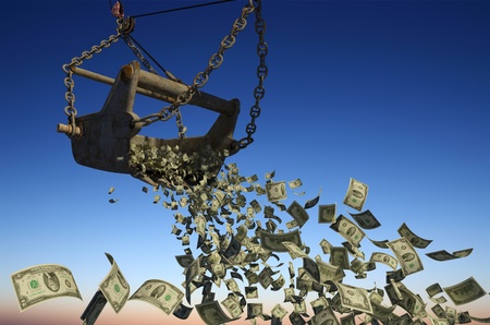 Banknotes of dollars are flying out of excavator bucket.の写真素材