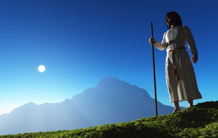 Jesus is in the background of a mountain landscape.の写真素材