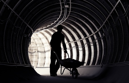 Silhouette of workers in mineの写真素材