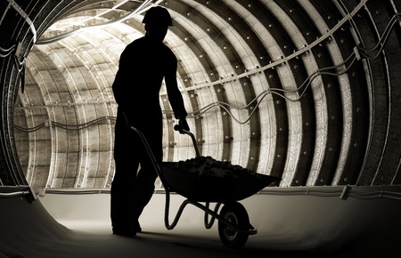 Silhouette of workers in mineの写真素材